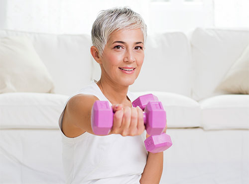 A woman using exercise to ease her arthritis